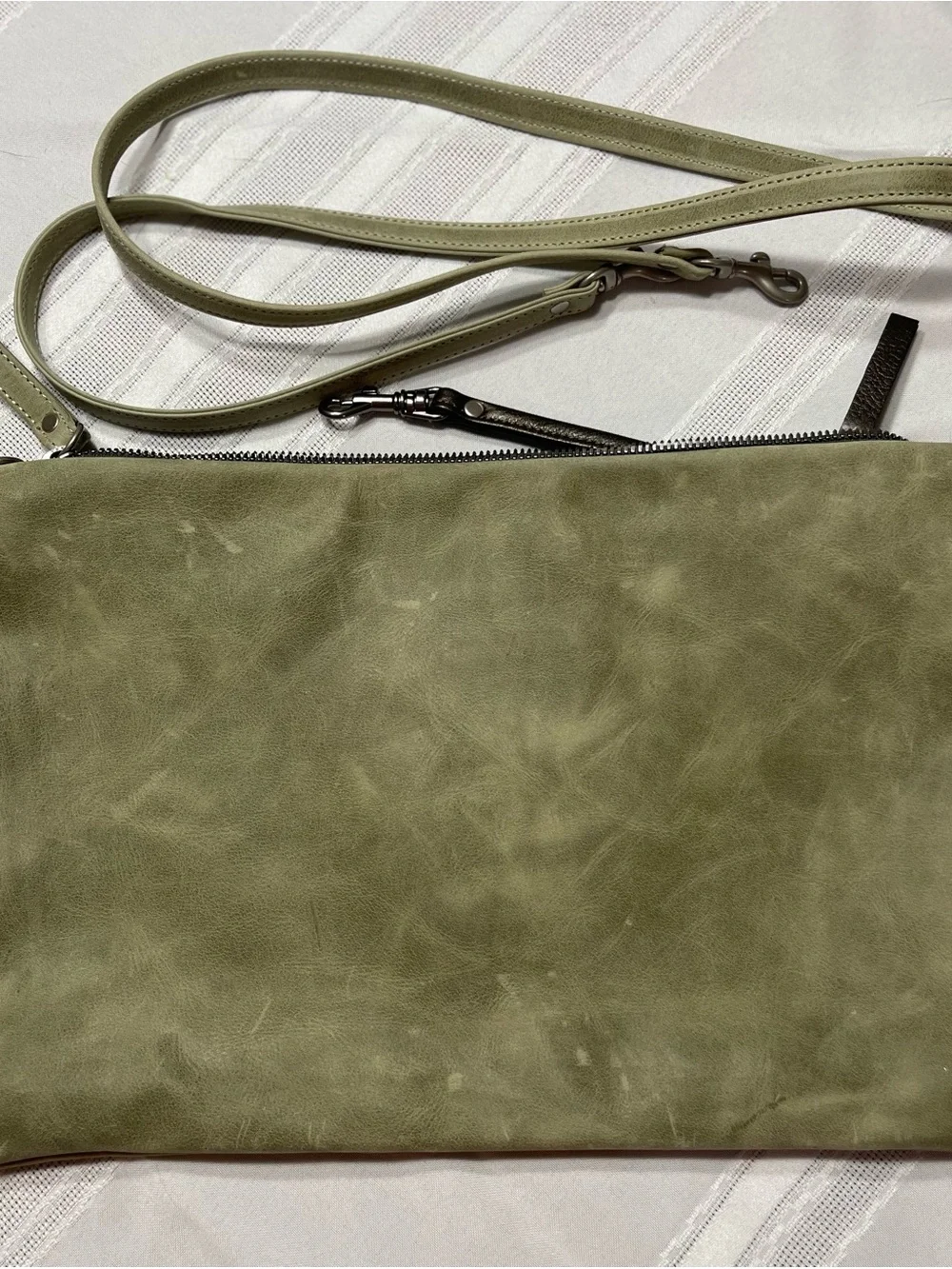 Rough & Tumble Covet in light green leather.